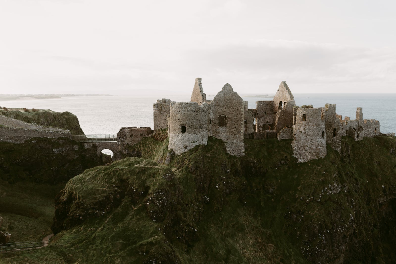 old medieval ruins of Dunluce Castle on ocean coast in northern Ireland famous place in uk